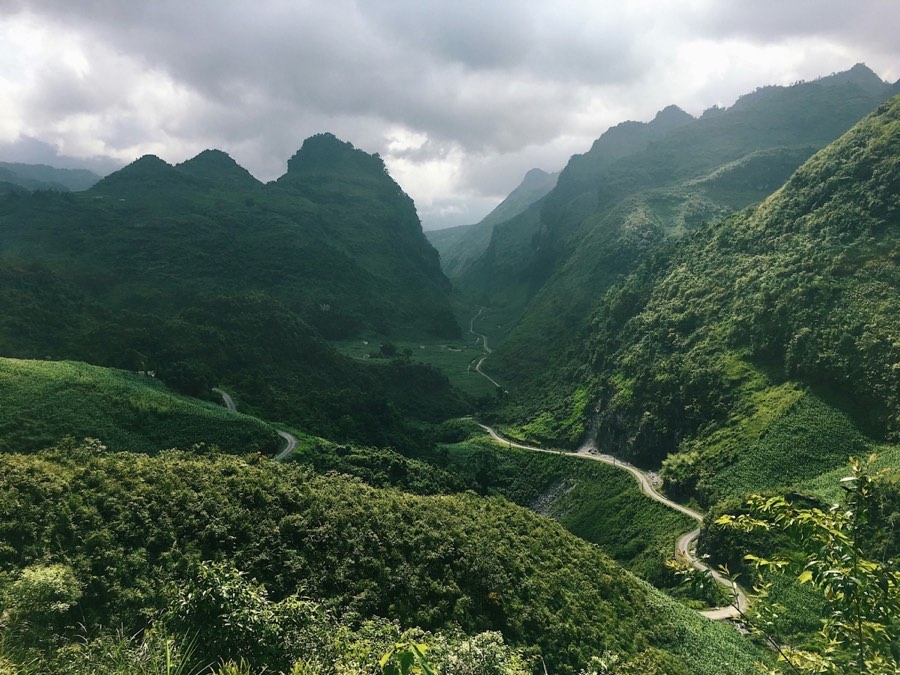 Green karst mountains with winding road in northern Vietnam near Cao Bang