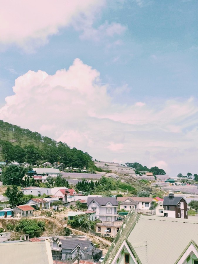 Da Lat town with rolling hills and pine trees in the background, Vietnam
