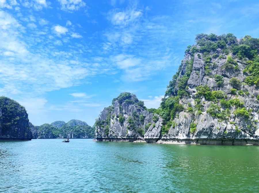 Ha Long Bay limestone mountains rising from calm waters, Vietnam