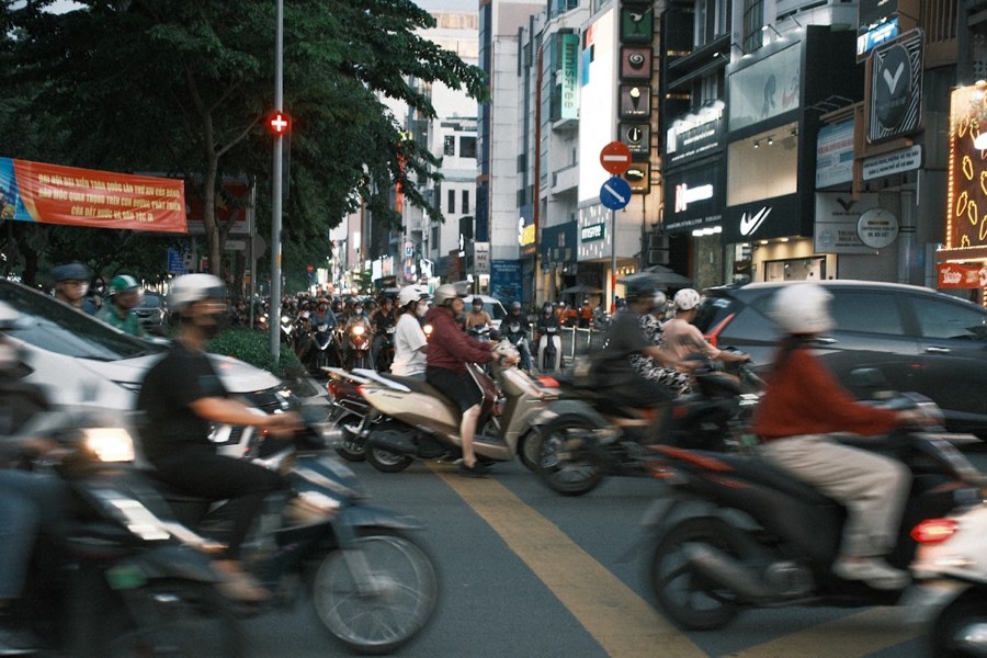 Busy Vietnamese city street with motorcycles and cars, Hai Phong area