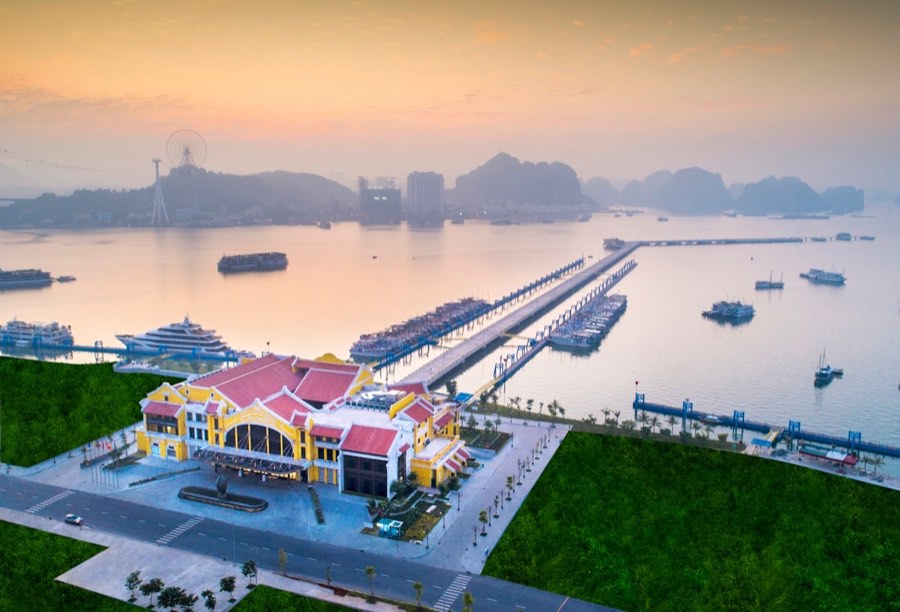 Colorful waterfront building with boats at sunrise, northern Vietnam