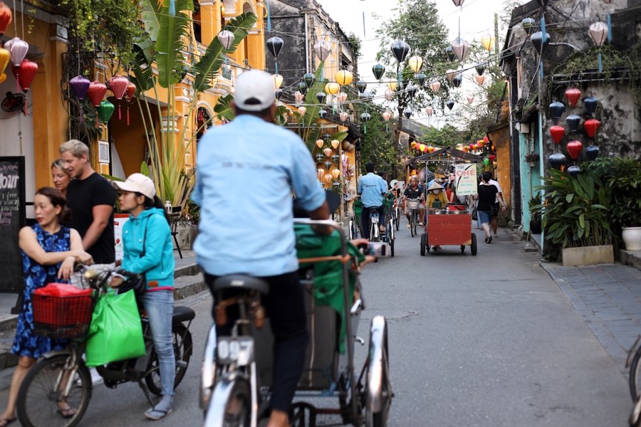 Busy street decorated with Vietnamese flags, northern Vietnam