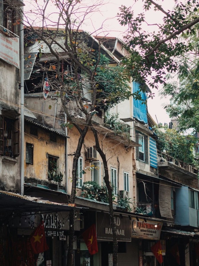 Row of buildings on a city street in Hanoi Old Quarter, Vietnam