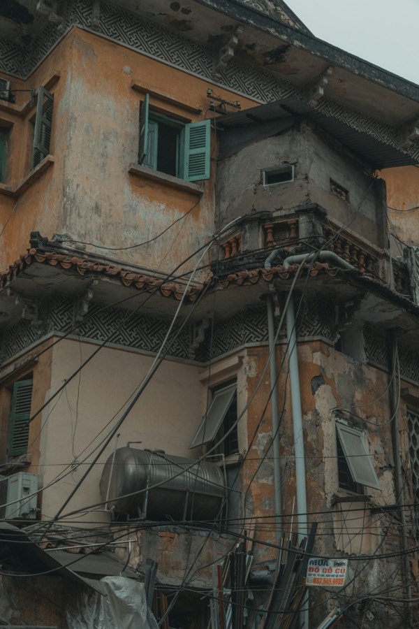 Old traditional building with tangled wires, Hanoi, Vietnam