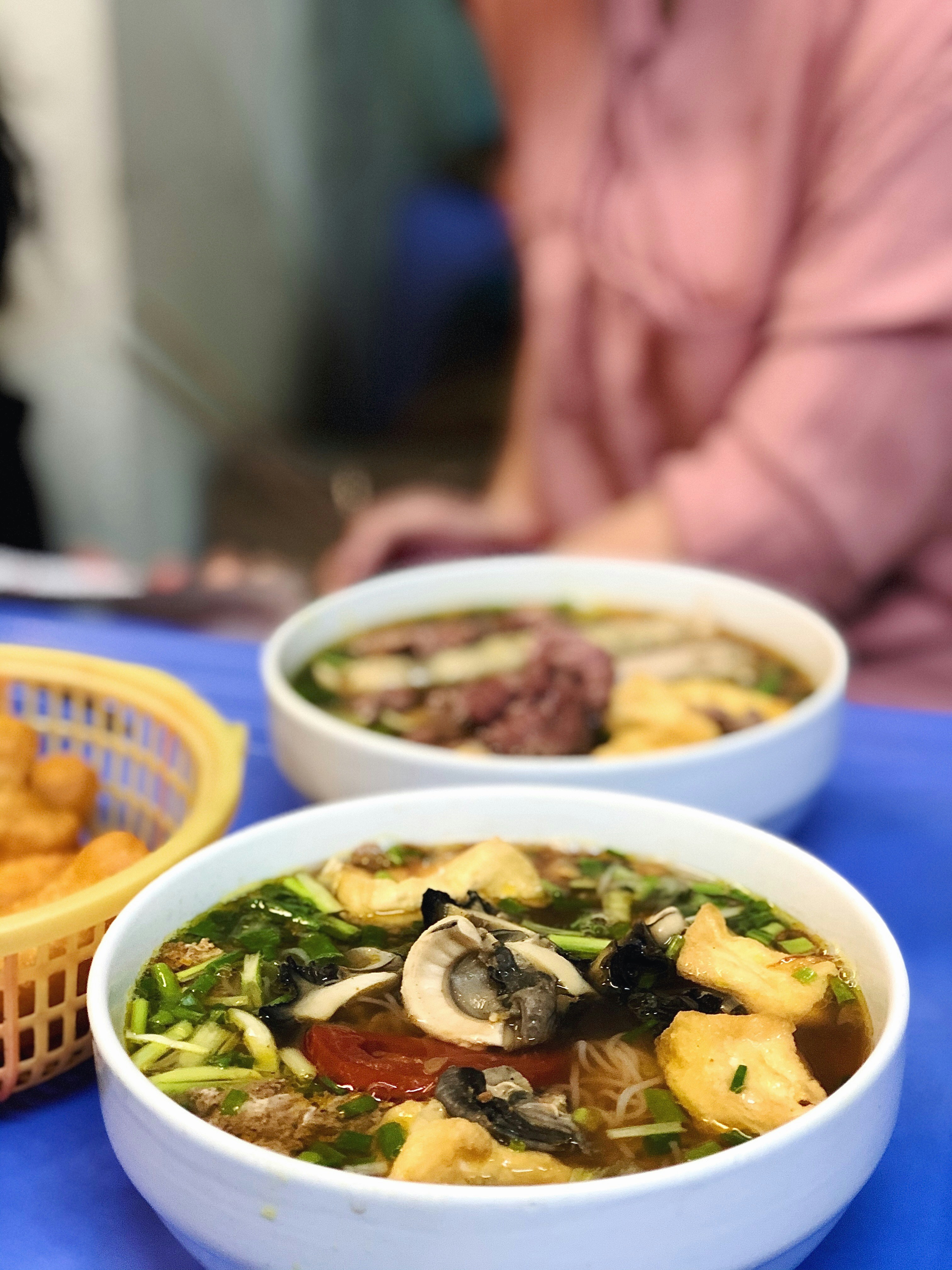 Bowl of Vietnamese stew in white ceramic bowl, Hue, Vietnam