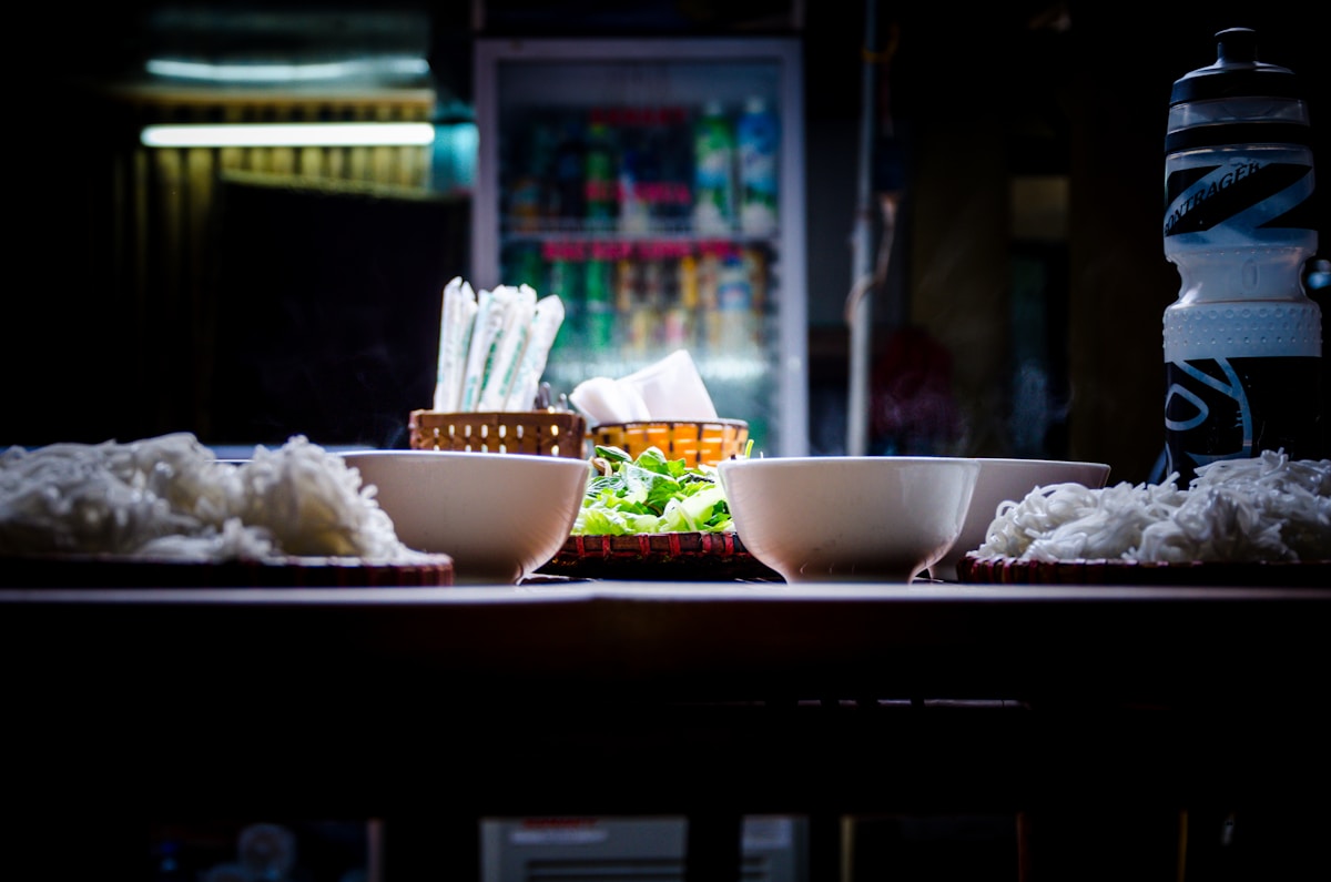 Vietnamese noodle bowls at a street food stall, Hue