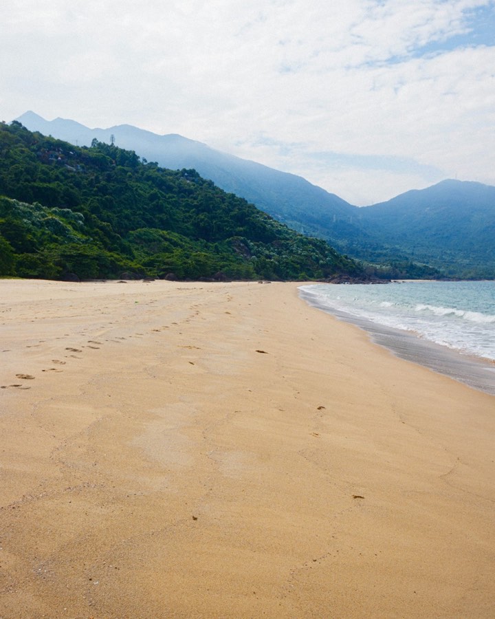 Aerial view of white sand beach and turquoise waters, central Vietnam coast
