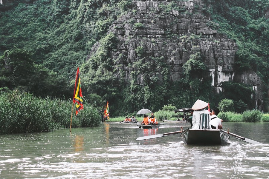 Tourists in boats on the river, Ninh Binh, Vietnam