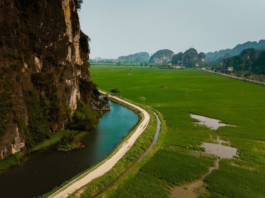 River winding through a lush green valley, Ninh Binh, Vietnam