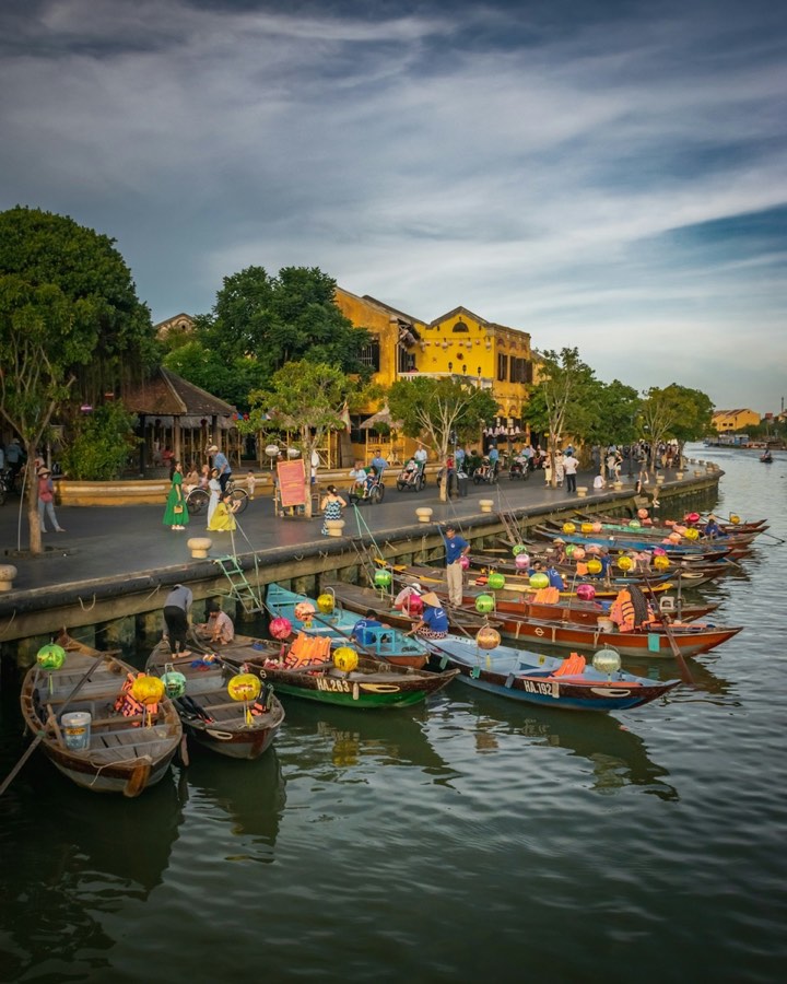 Colorful lantern boats moored on Thu Bon River, Hoi An Ancient Town, Vietnam