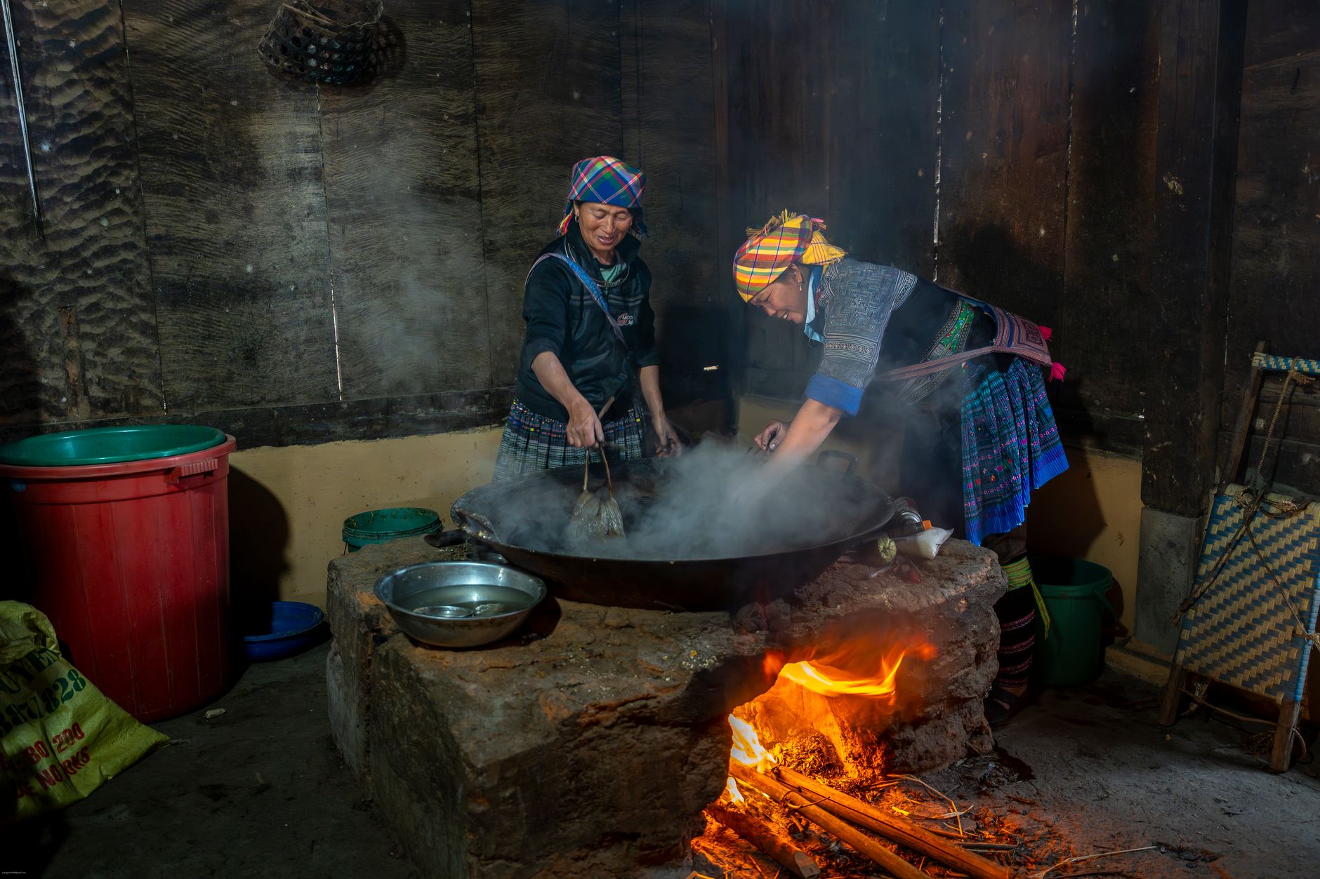 Highland dishes including bamboo rice and grilled meat served at a wooden restaurant in Sapa